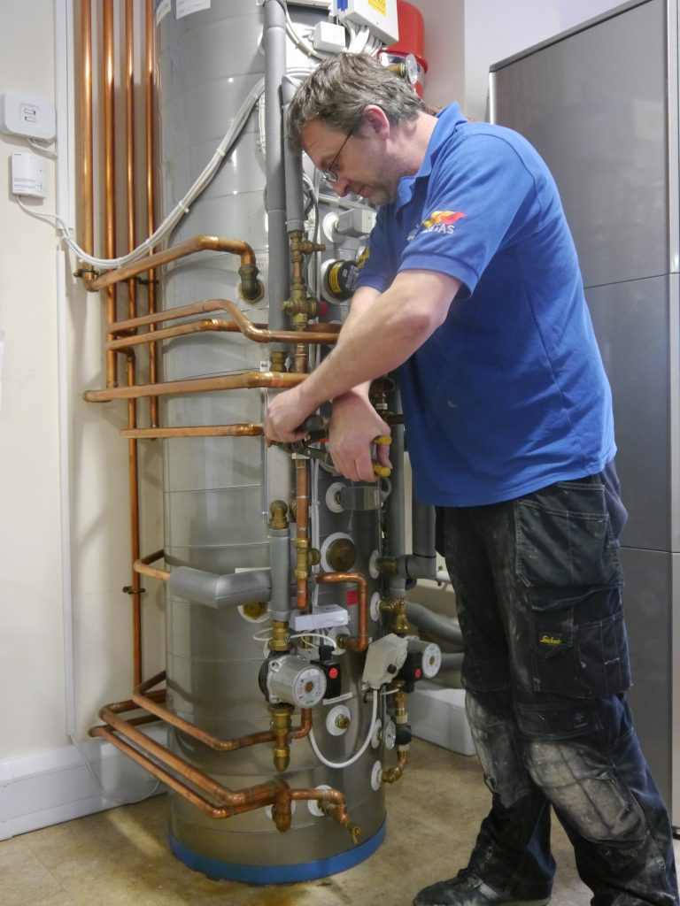 Engineer works on complex plumbing
