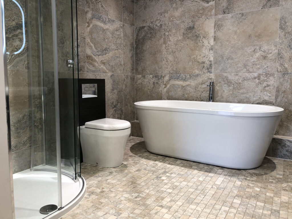 a modern bathroom with walk in shower and bath